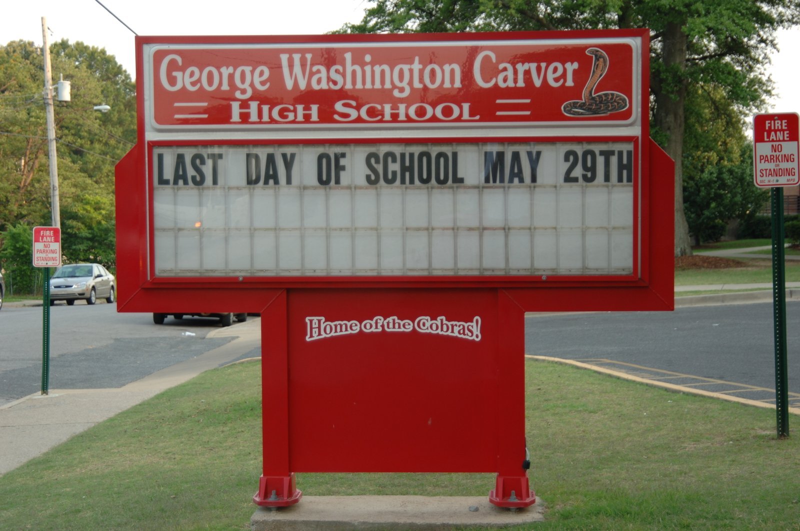 George Washington Carver High School sign with red frame and 'Home of the Cobras' text