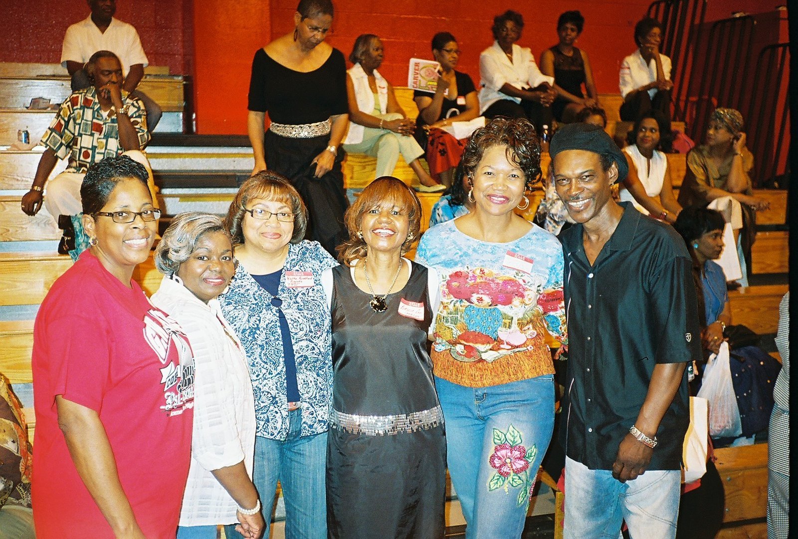 Alumni group at school gymnasium event