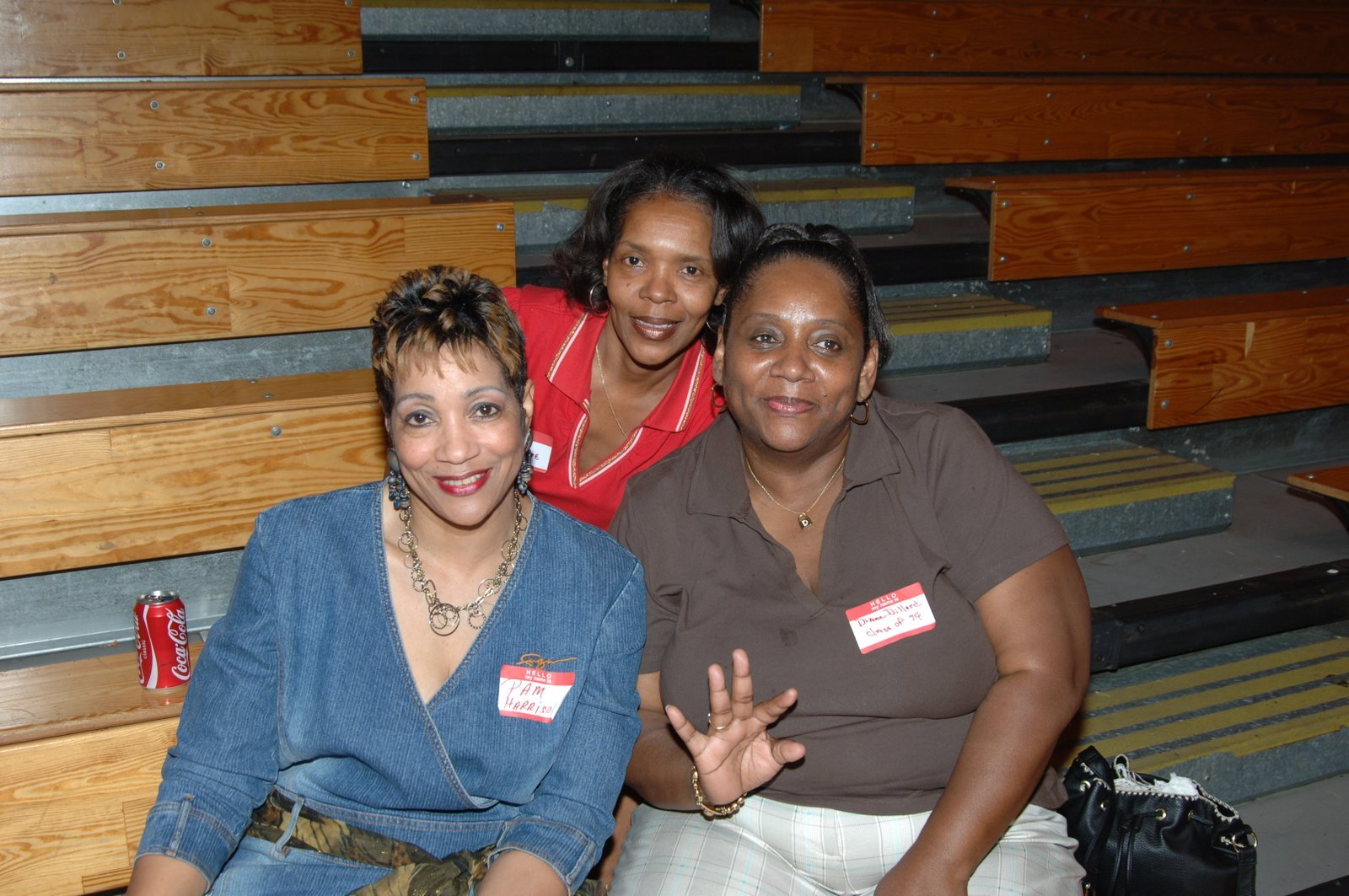 Alumni at school gymnasium bleachers