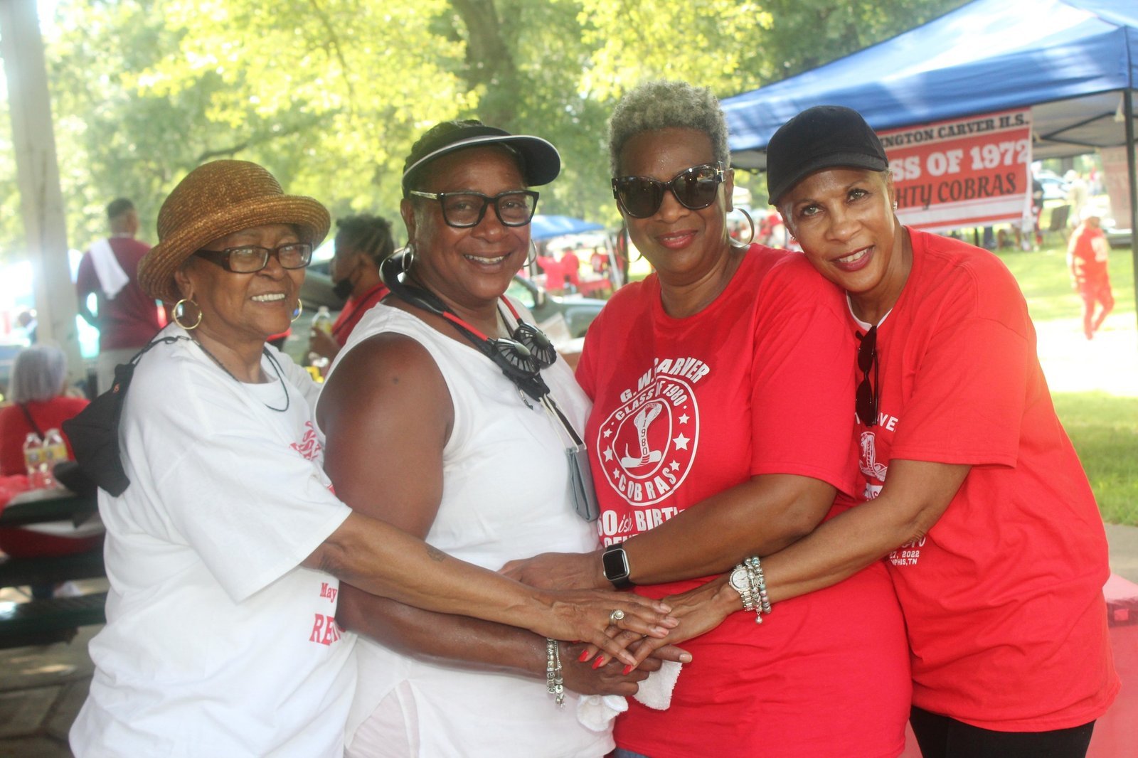 Alumni women group photo at outdoor event