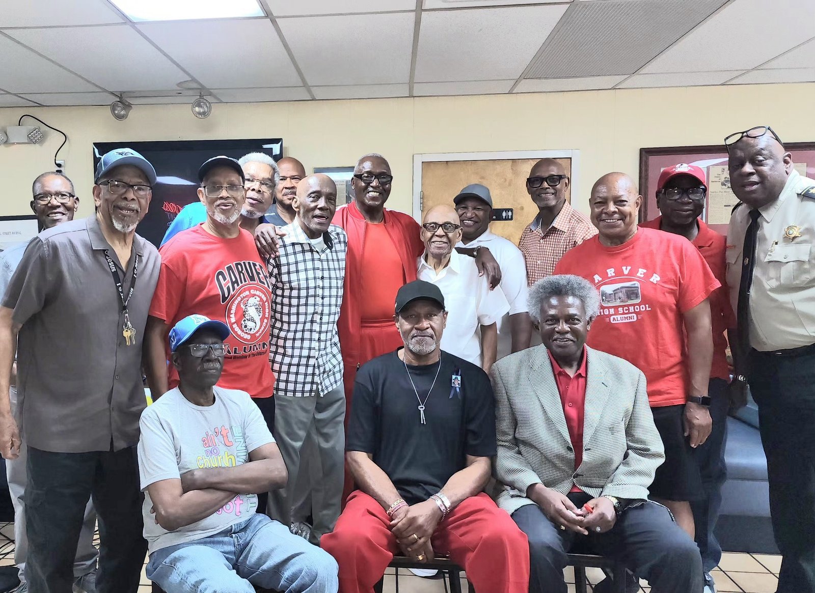 Alumni group at school event with red Carver shirts