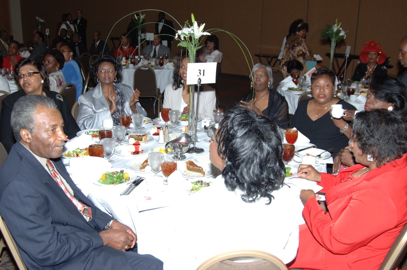 Alumni at formal dinner event with elegant table settings