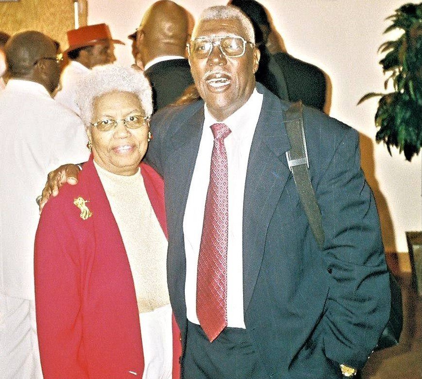 Vintage photo of elderly alumni man with tall man in formal attire
