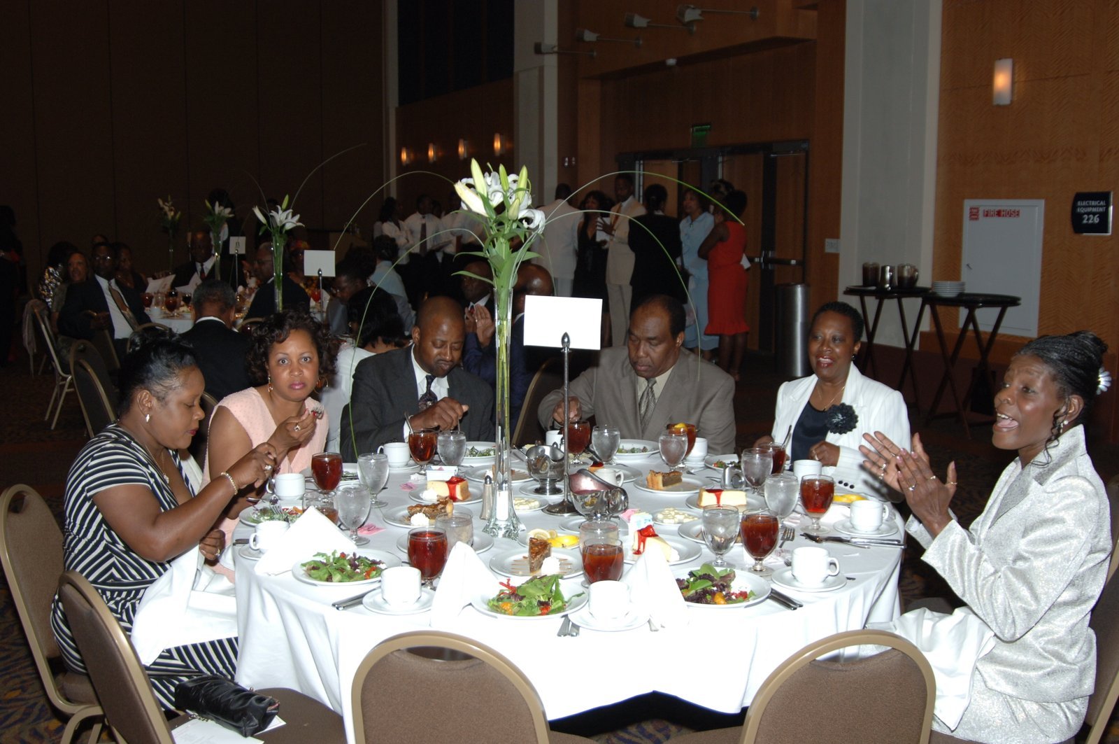 Alumni at formal banquet dinner with table settings