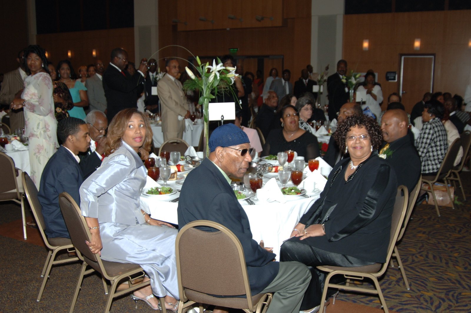 Alumni at formal dinner event with table settings