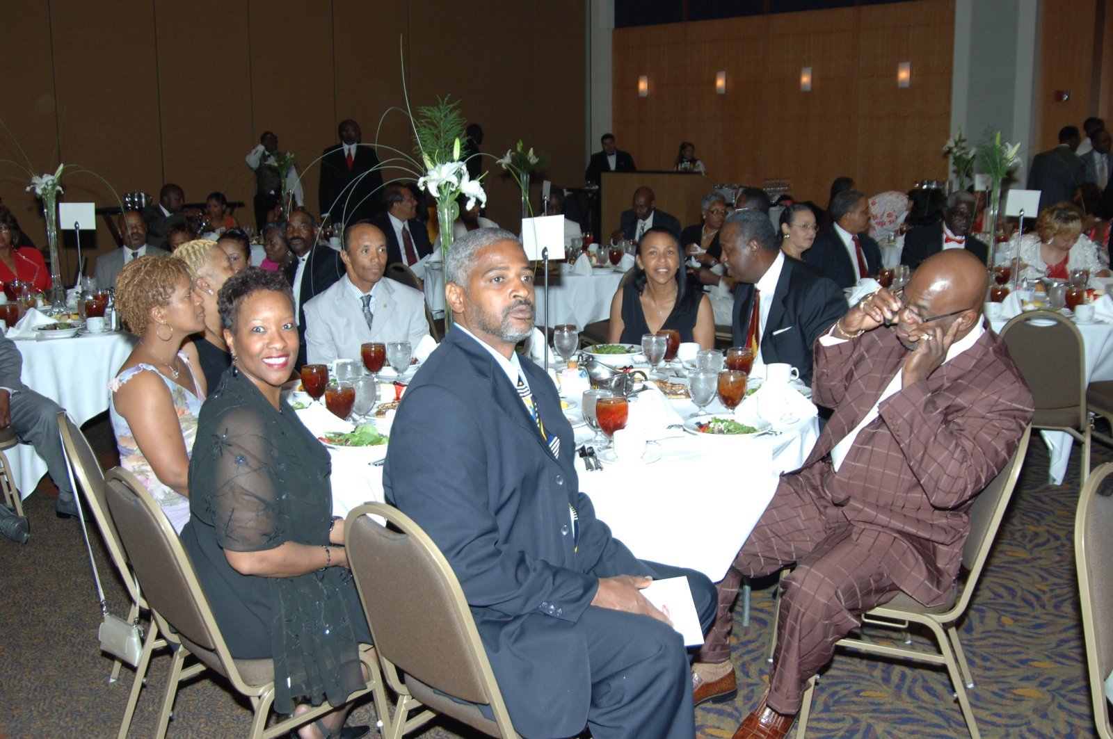 Alumni at formal banquet event with elegant table settings