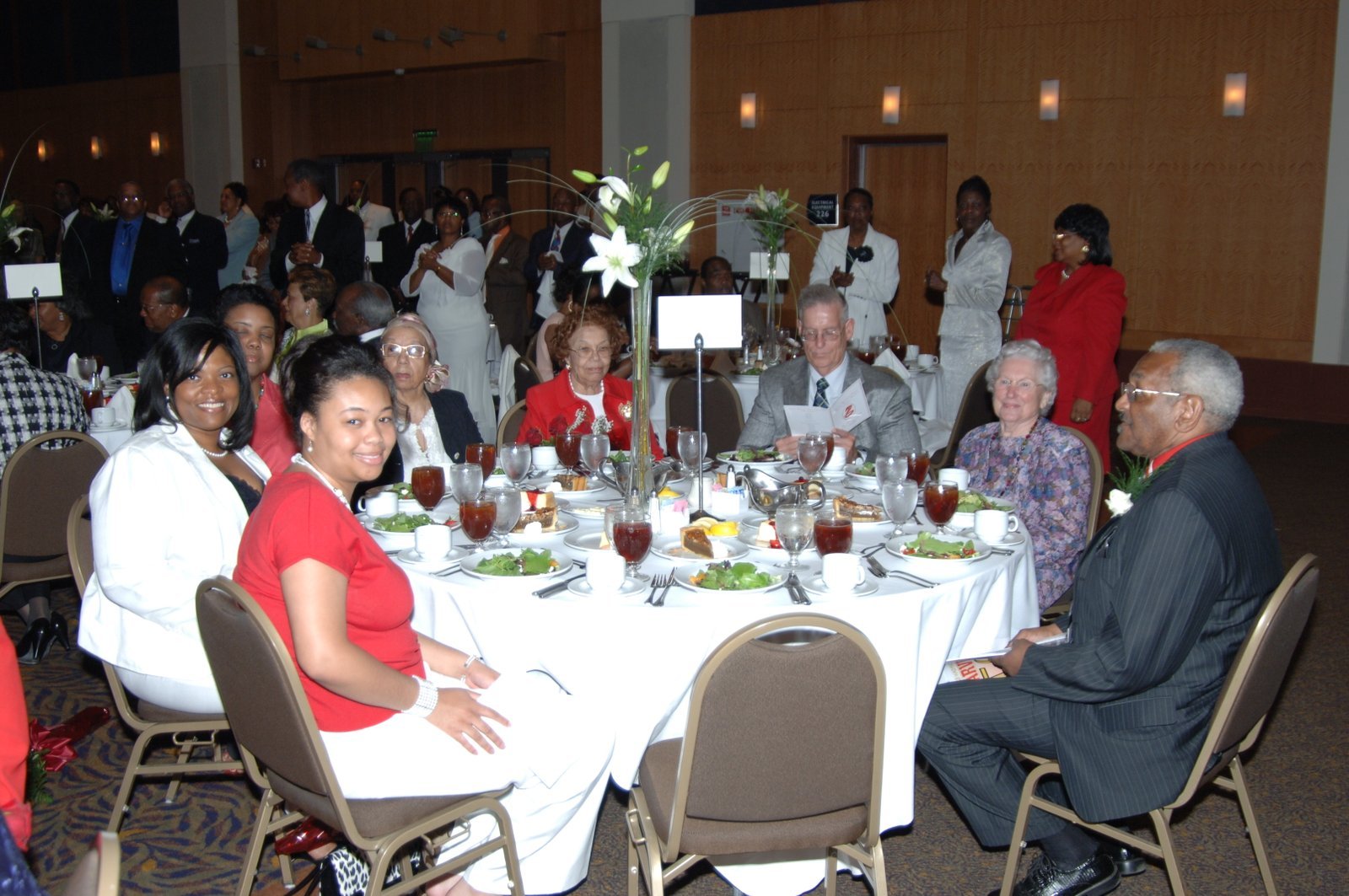 Alumni at formal banquet event with flowers and decorations