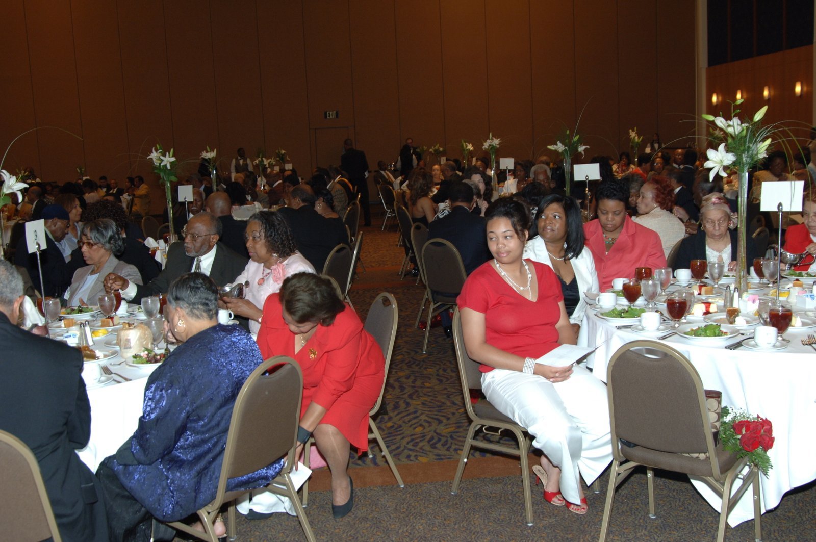 Alumni at formal event with flowers and decorations