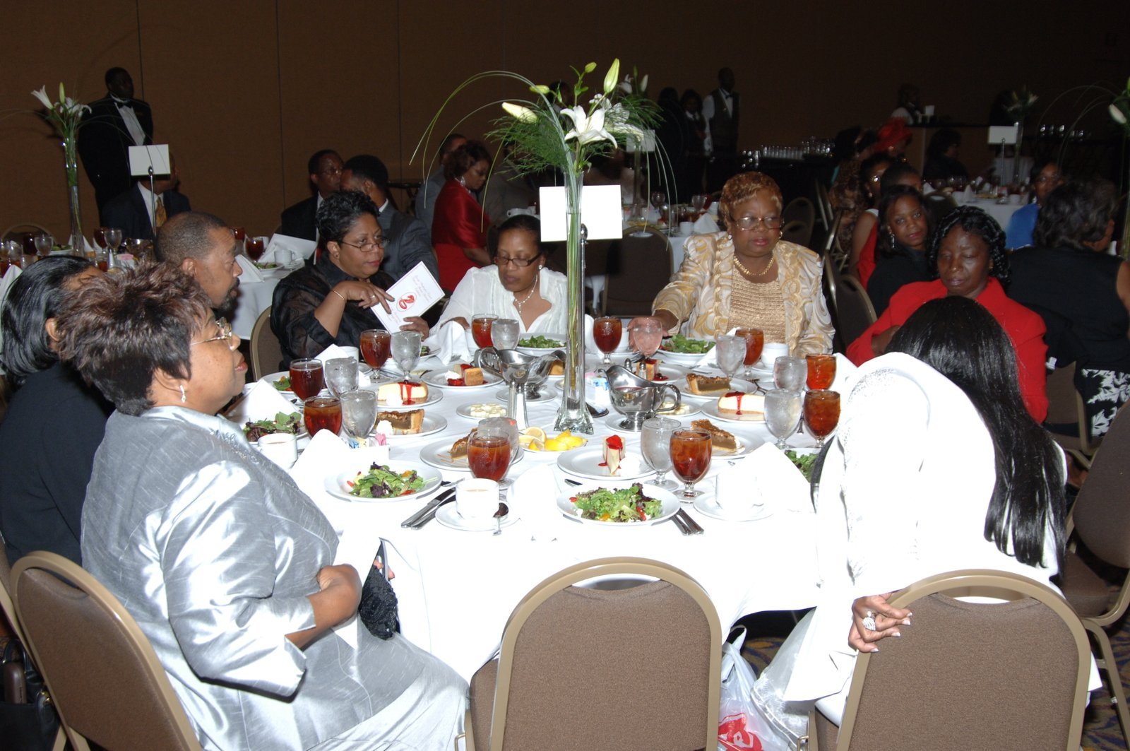 Alumni at formal banquet event with table settings