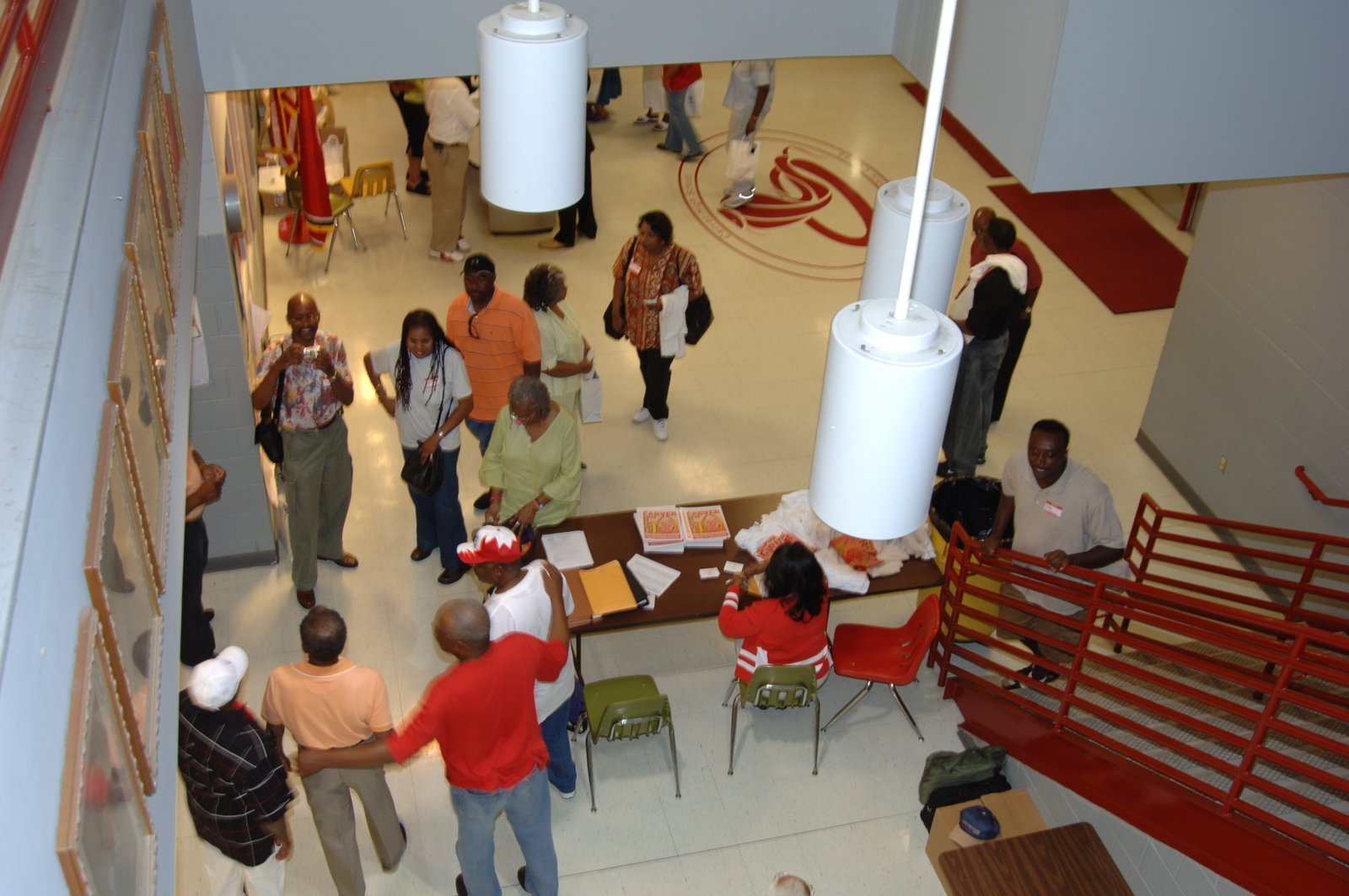 Overhead view of school hallway with red and white decor