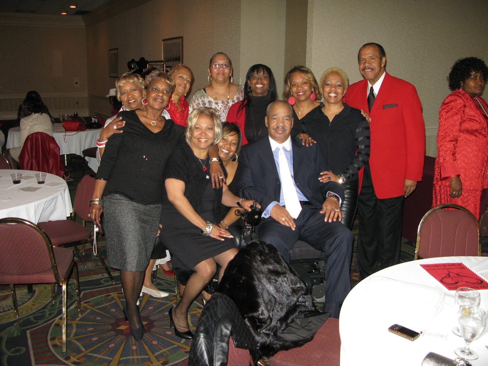 Alumni group at formal event with elegant attire