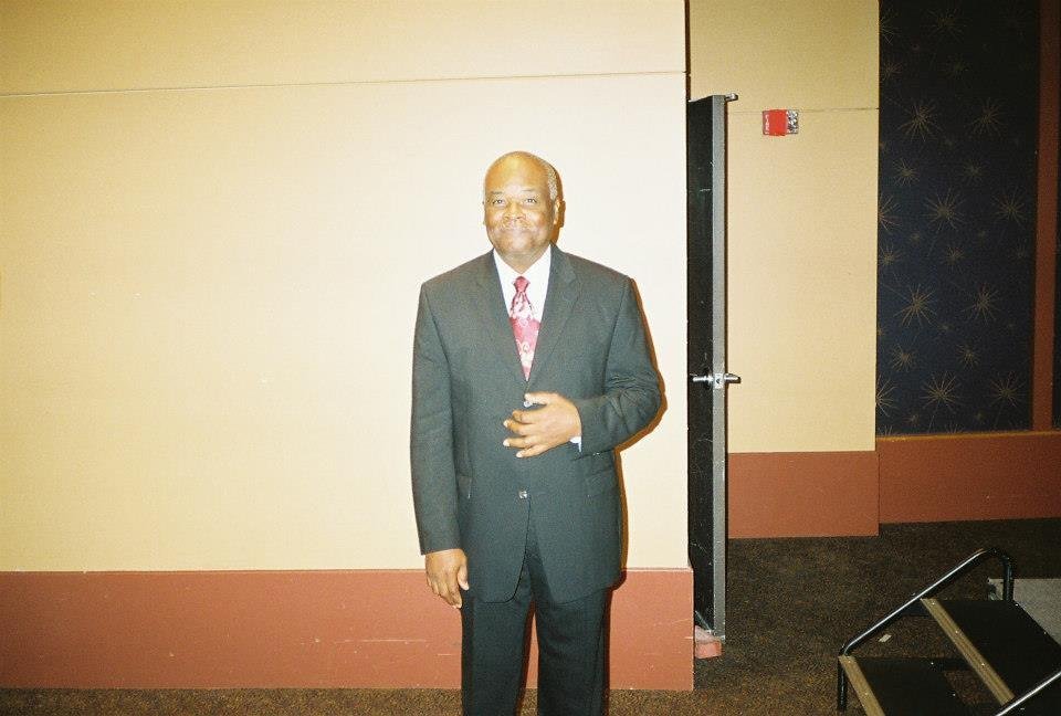 Alumni men in formal business suits at event
