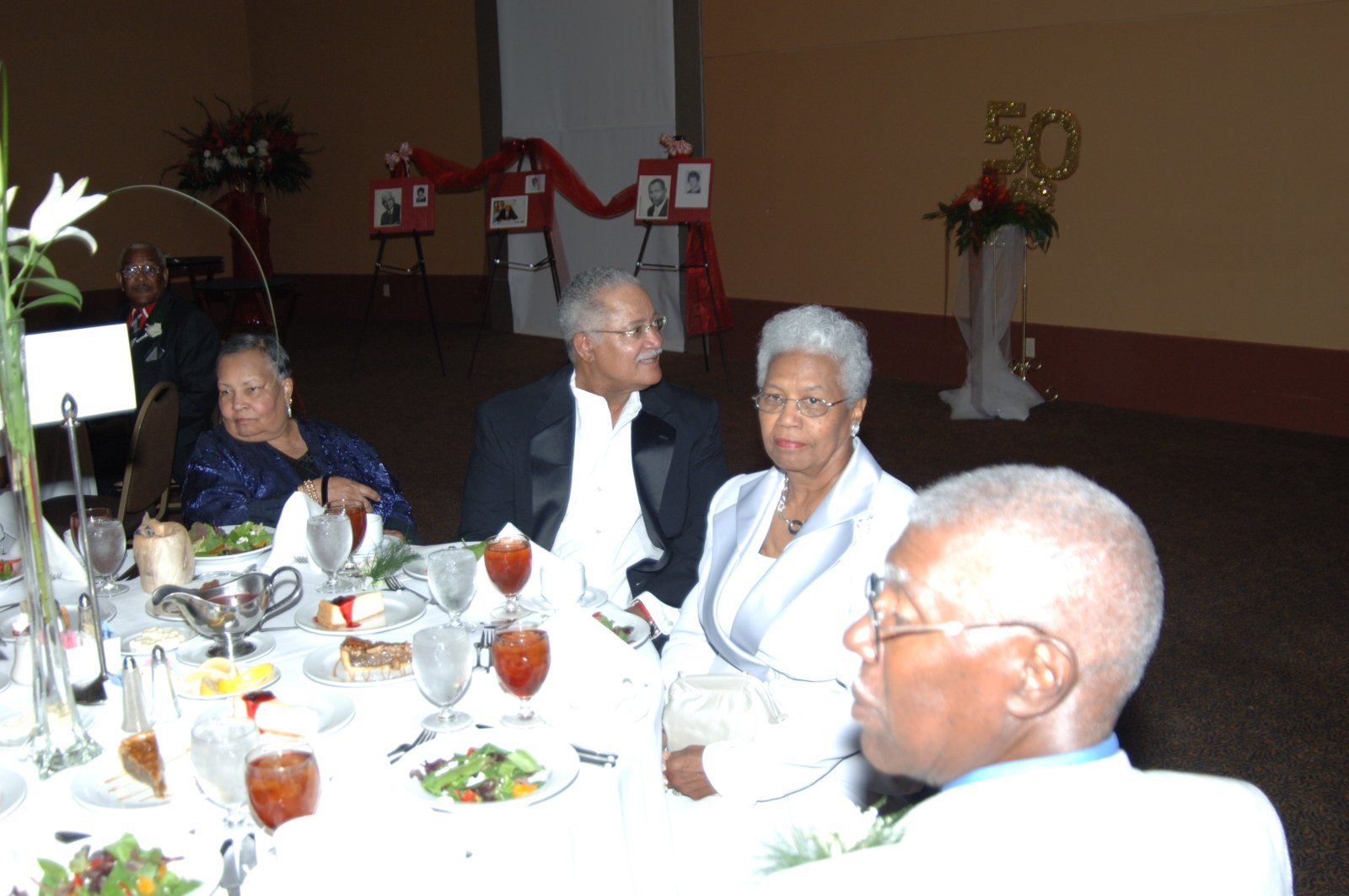 Alumni at formal banquet event with elegant decor