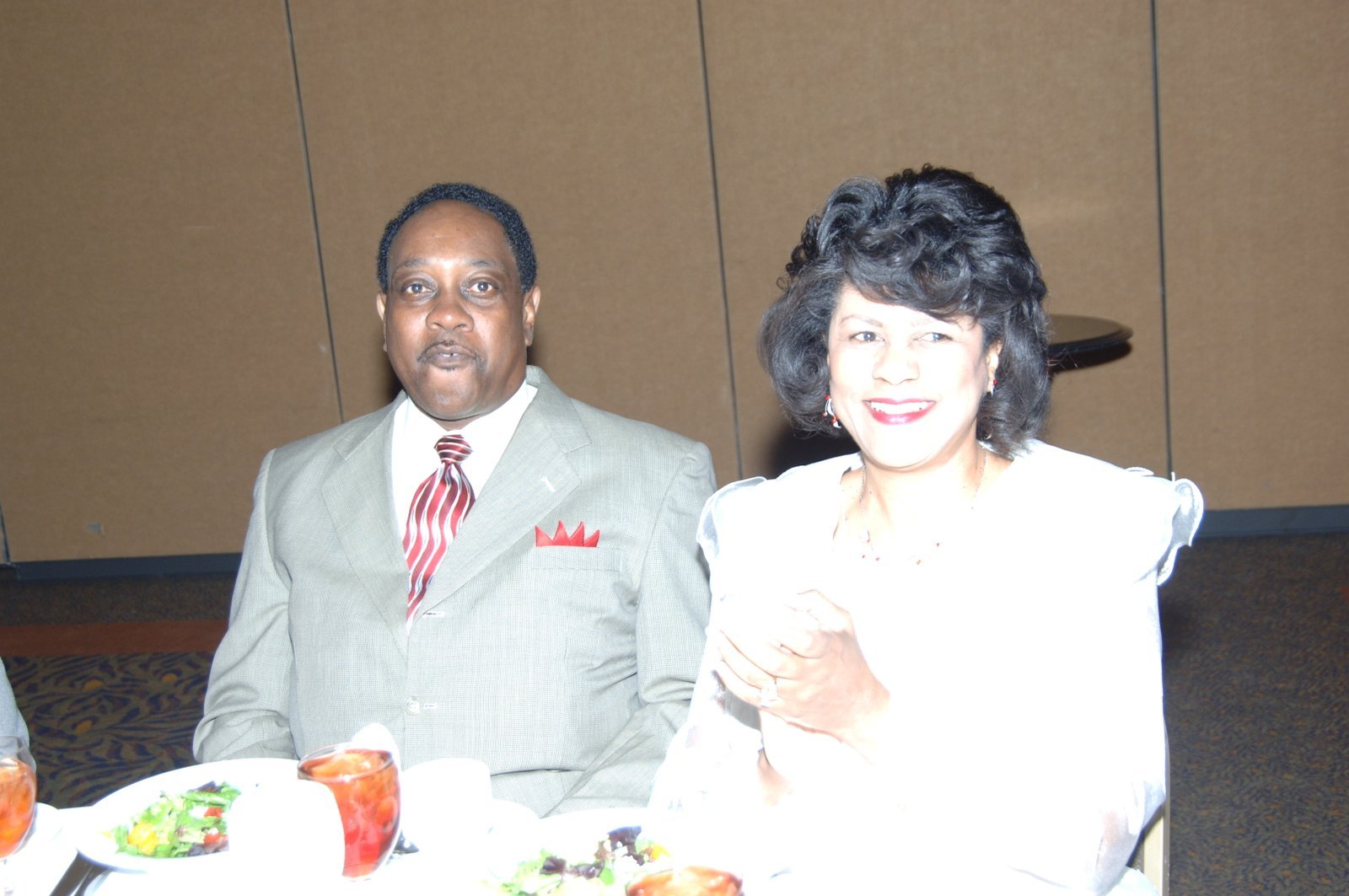 Alumni couple at formal event with elegant attire