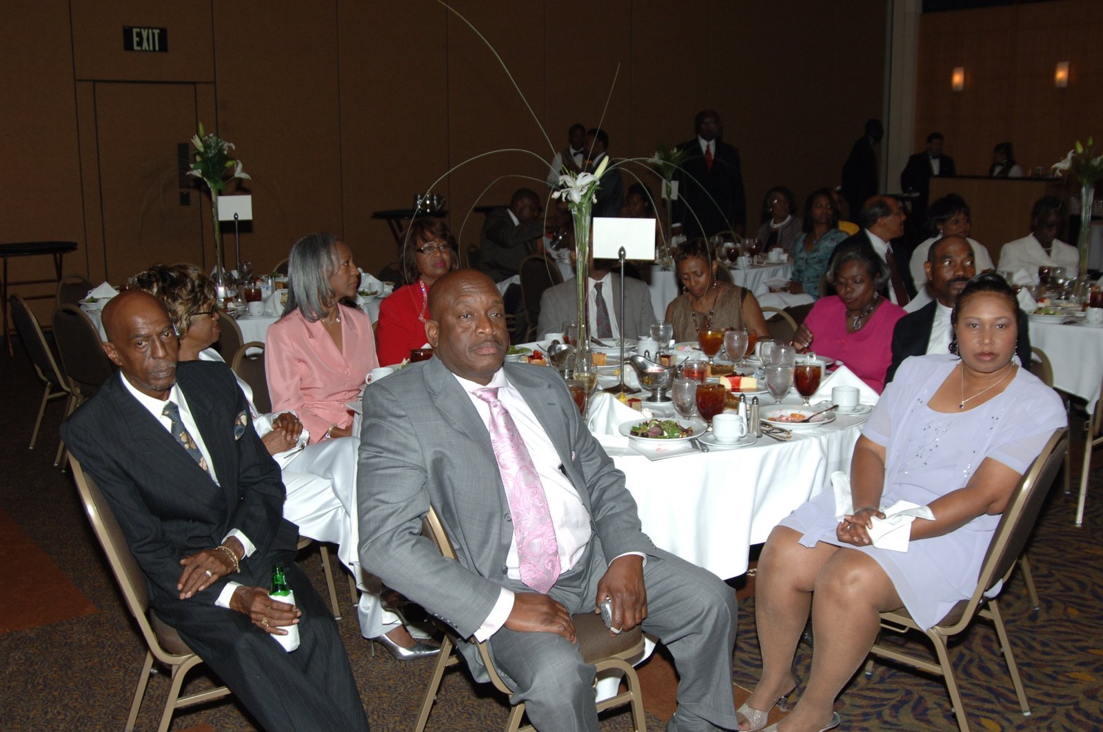Alumni at formal banquet event with elegant table arrangements